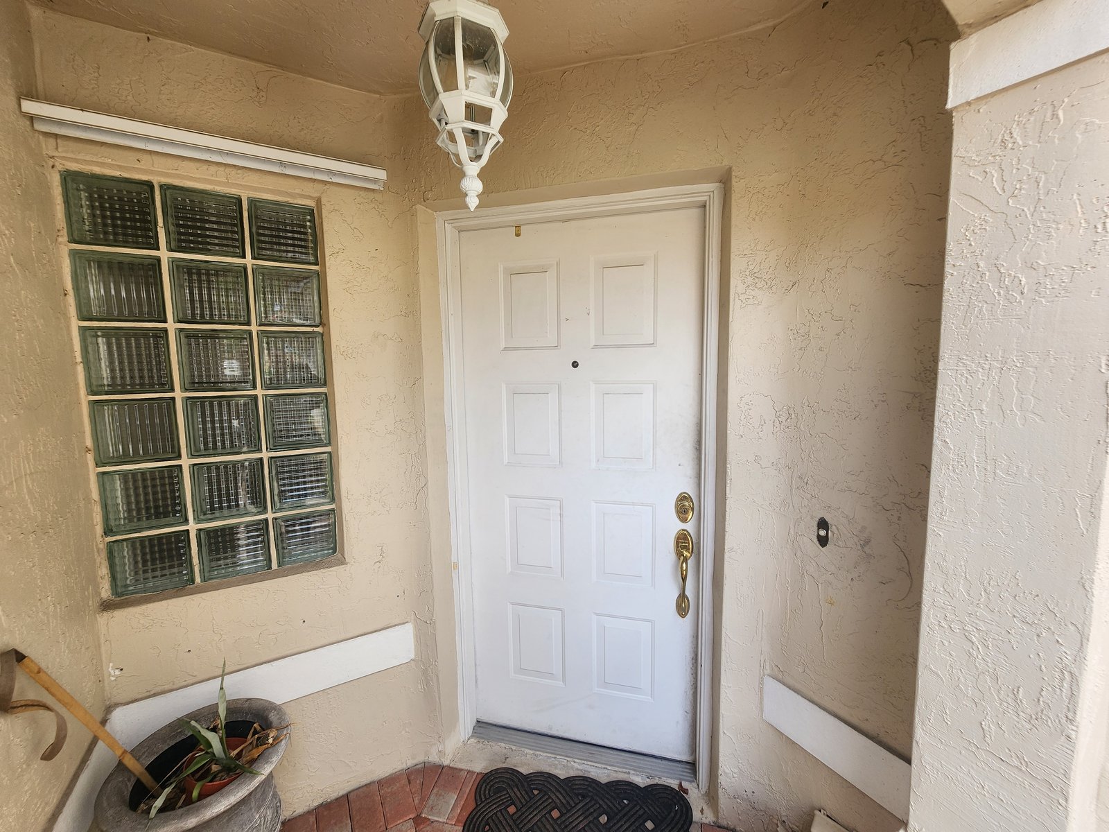 986 SW 180th Ter — Front door and glass-block window