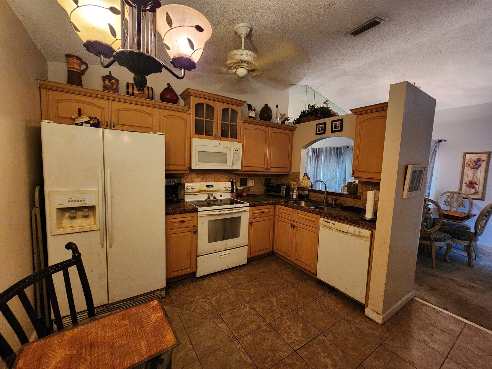 986 SW 180th Ter — Kitchen — original cabinets