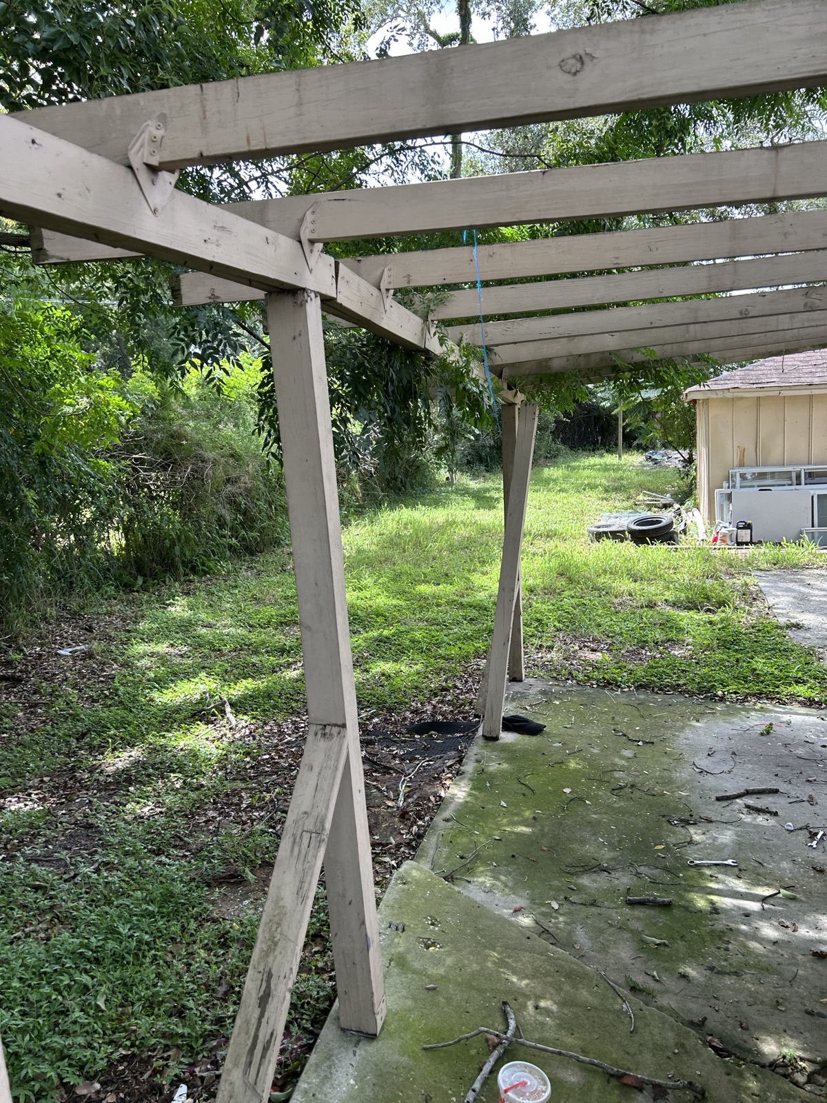 1500 43rd St — Carport frame, looking down the lot