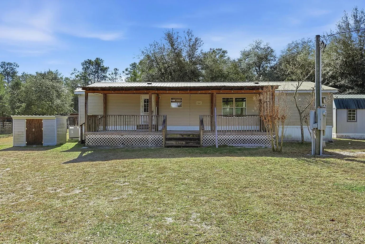 Front elevation — covered porch runs the full width