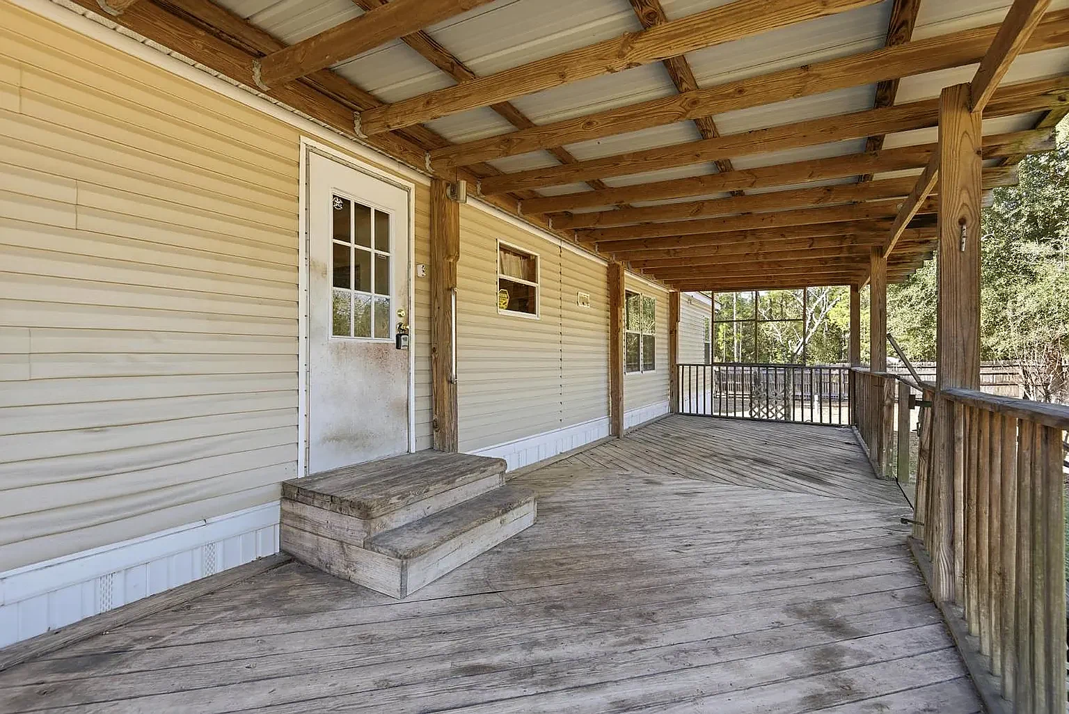 Covered walkway down the side of the home