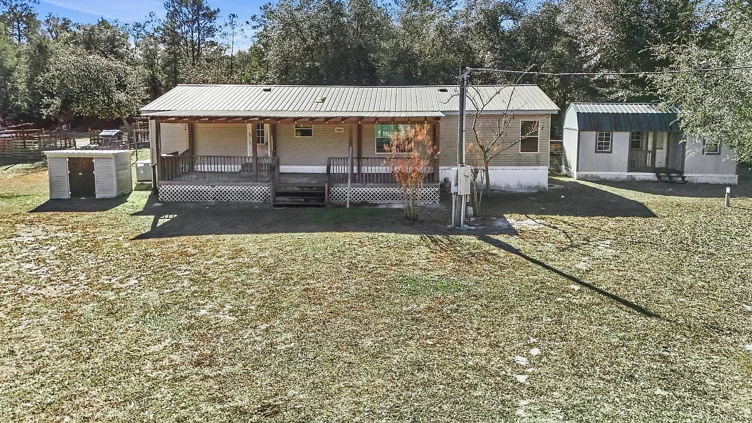 Rear elevation, storage shed beyond