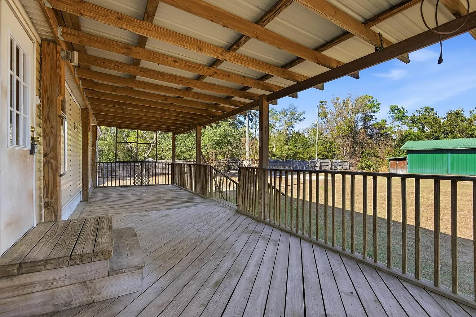 Rear deck runs the length of the house, fully covered