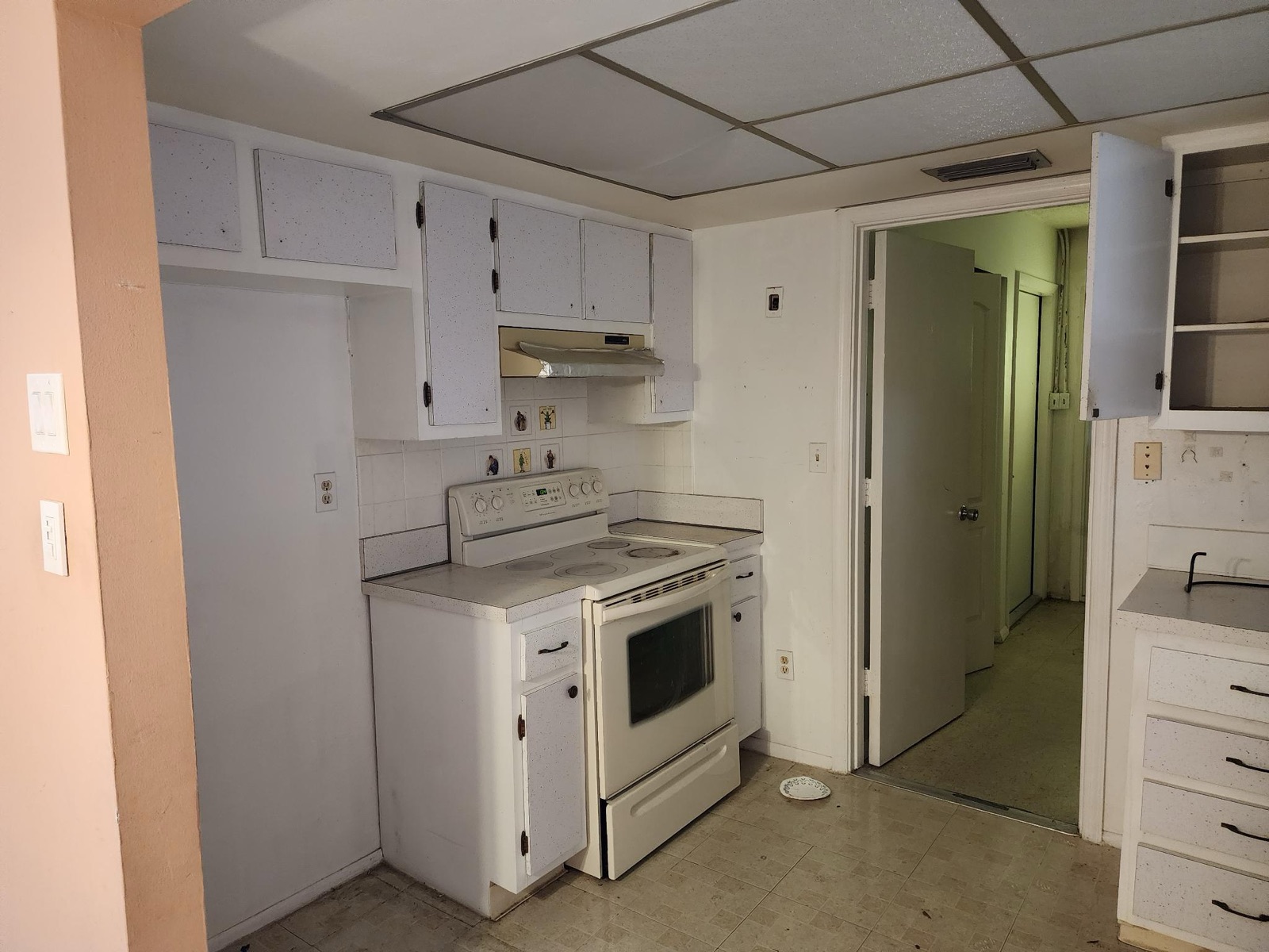 Kitchen — original cabinets and range